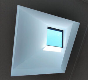 Skylight installation in a bedroom.