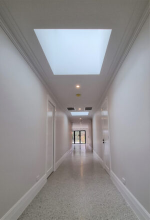 Skylights through the hallway in a house.