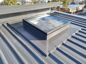 Fixed skylight on the house metal roof.