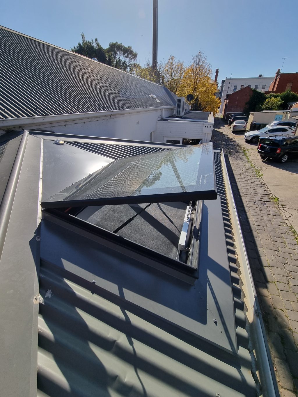 Operable skylight on metal roof