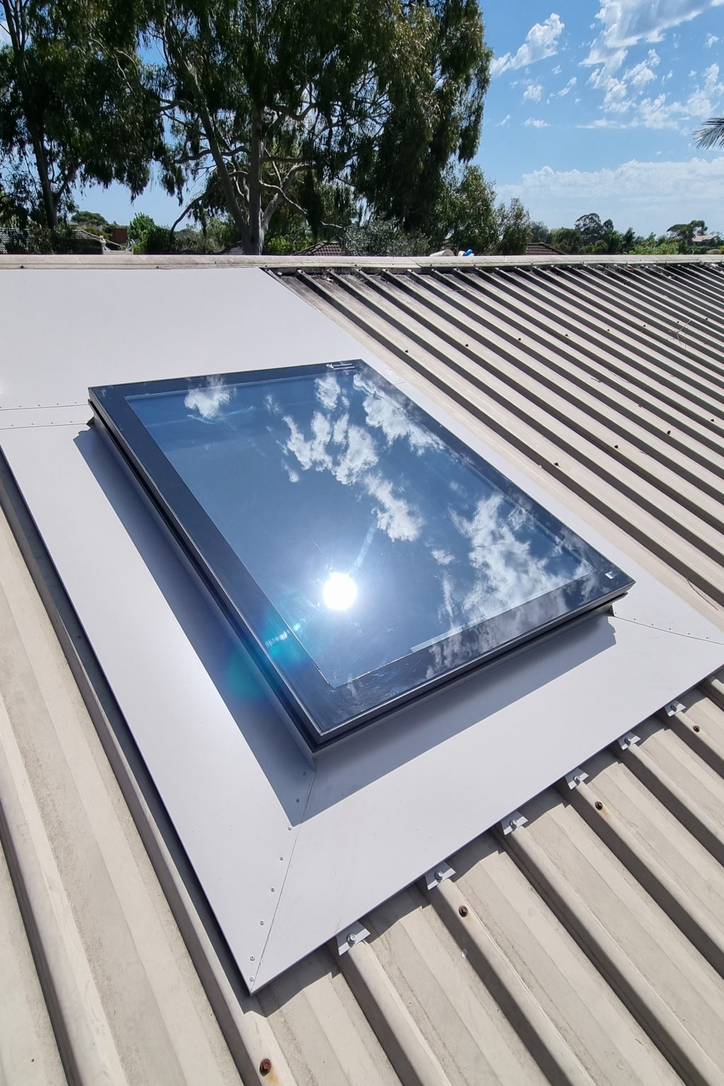 Operable skylight on metal roof