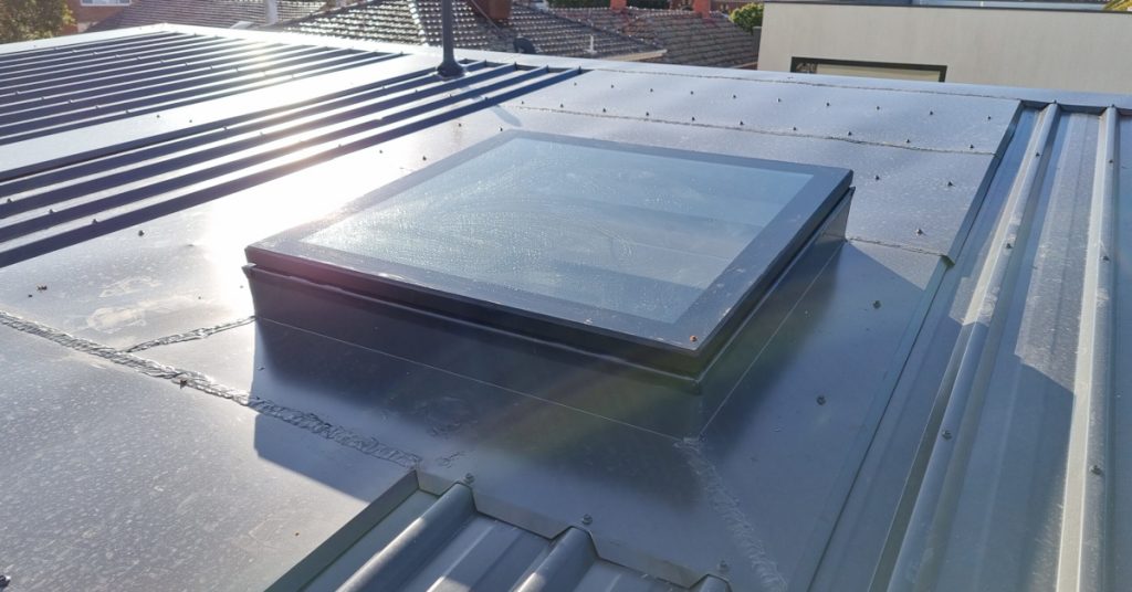 Fixed skylight on the house metal roof.