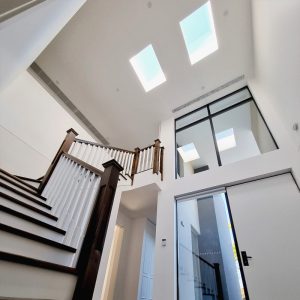 Twin skylights above a staircase.