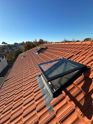 Electric operable skylights on tiled roof