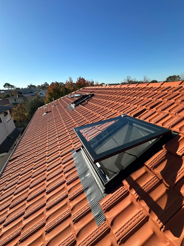 Electric opening skylight on a tiled roof