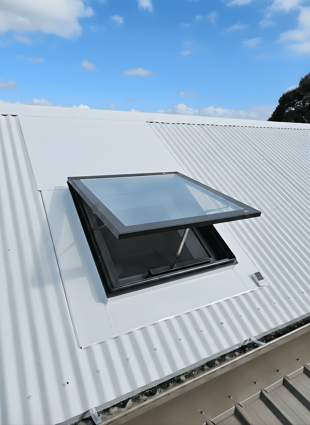 Operable skylight on a metal roof