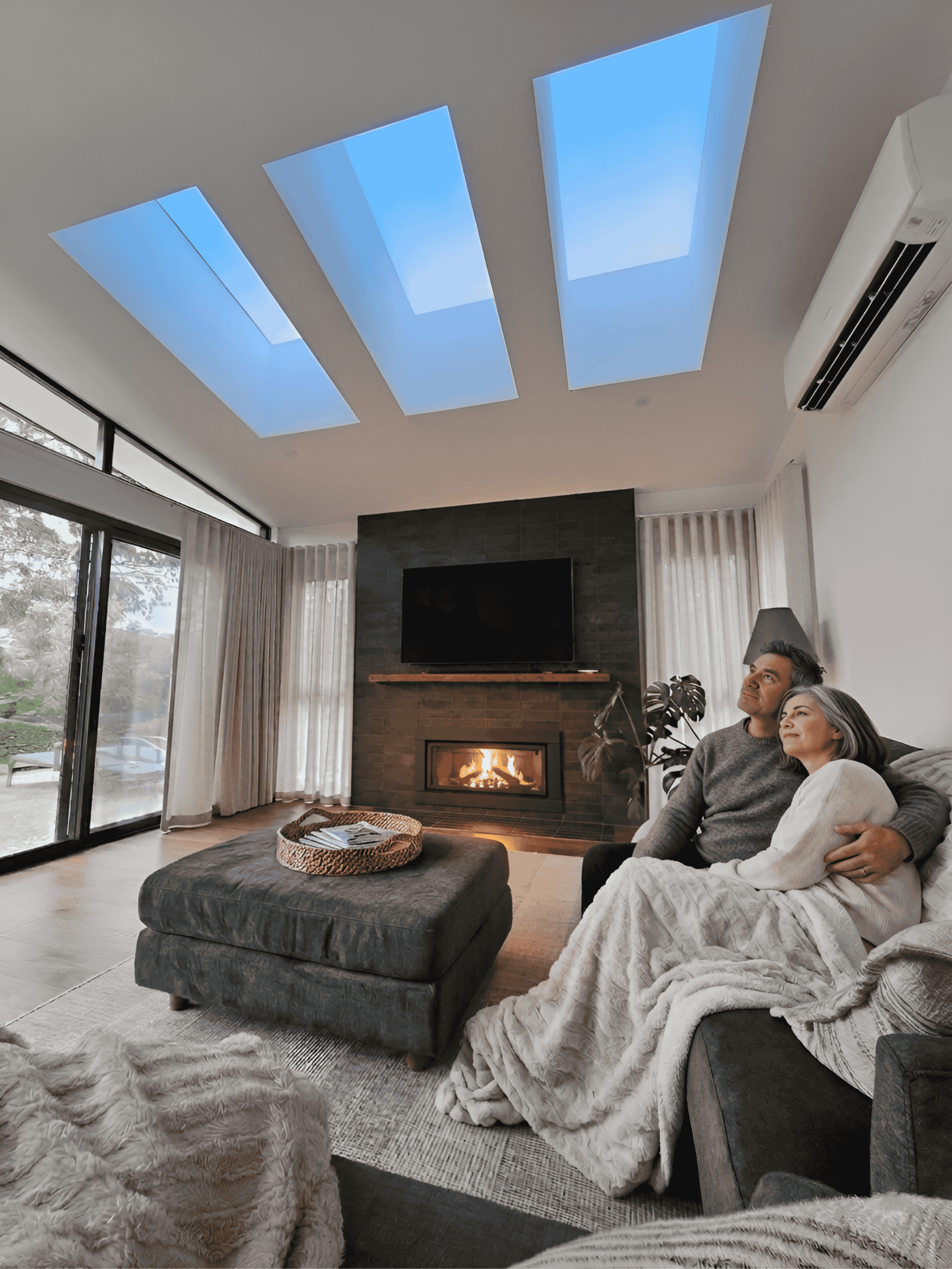 Middle aged couple sitting under 3 Vivid Skylights